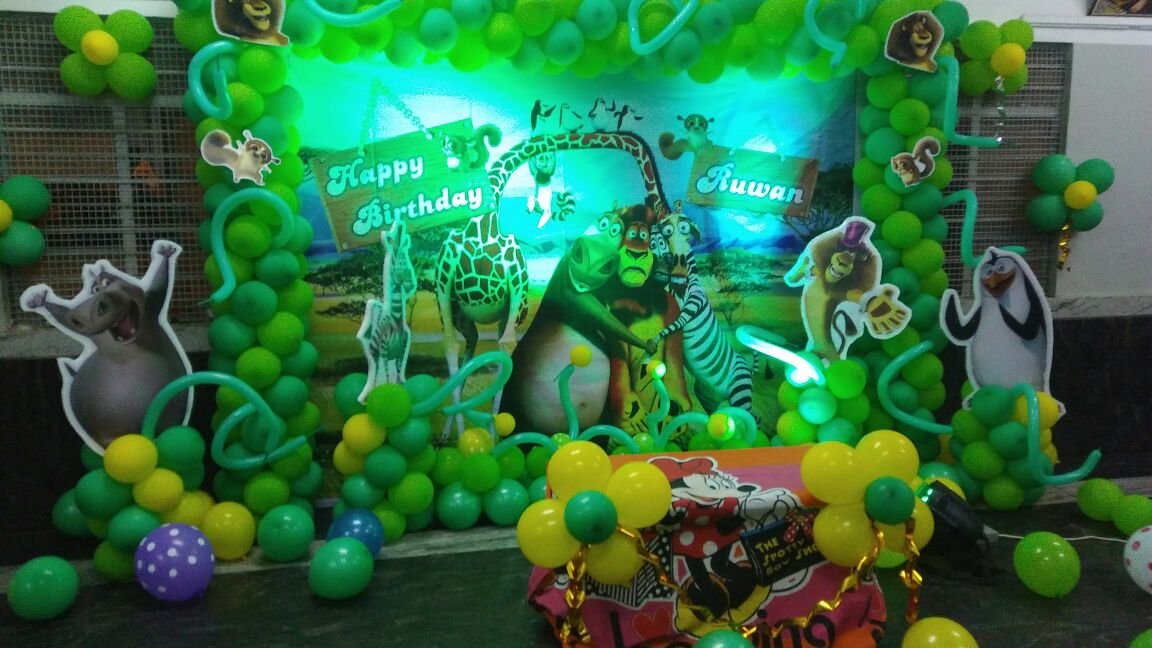 Madagaskar theme banner birthday party balloon decorators Bangalore