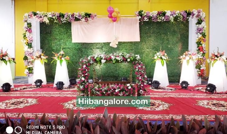 Grass backdrop naming ceremony decorators Bangalore