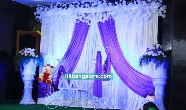 White backdrop naming ceremony flower decoration Bangalore