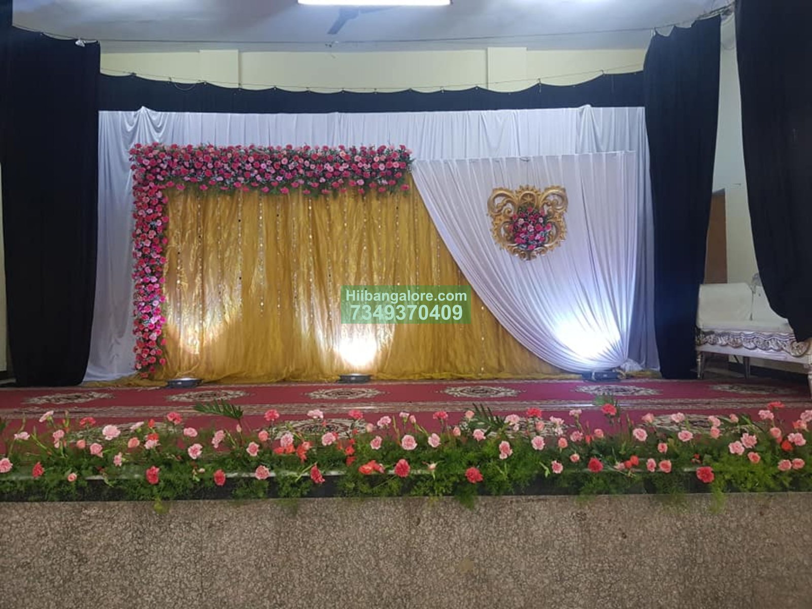 Gold backdrop engagement flower decoration Bangalore Bangalore
