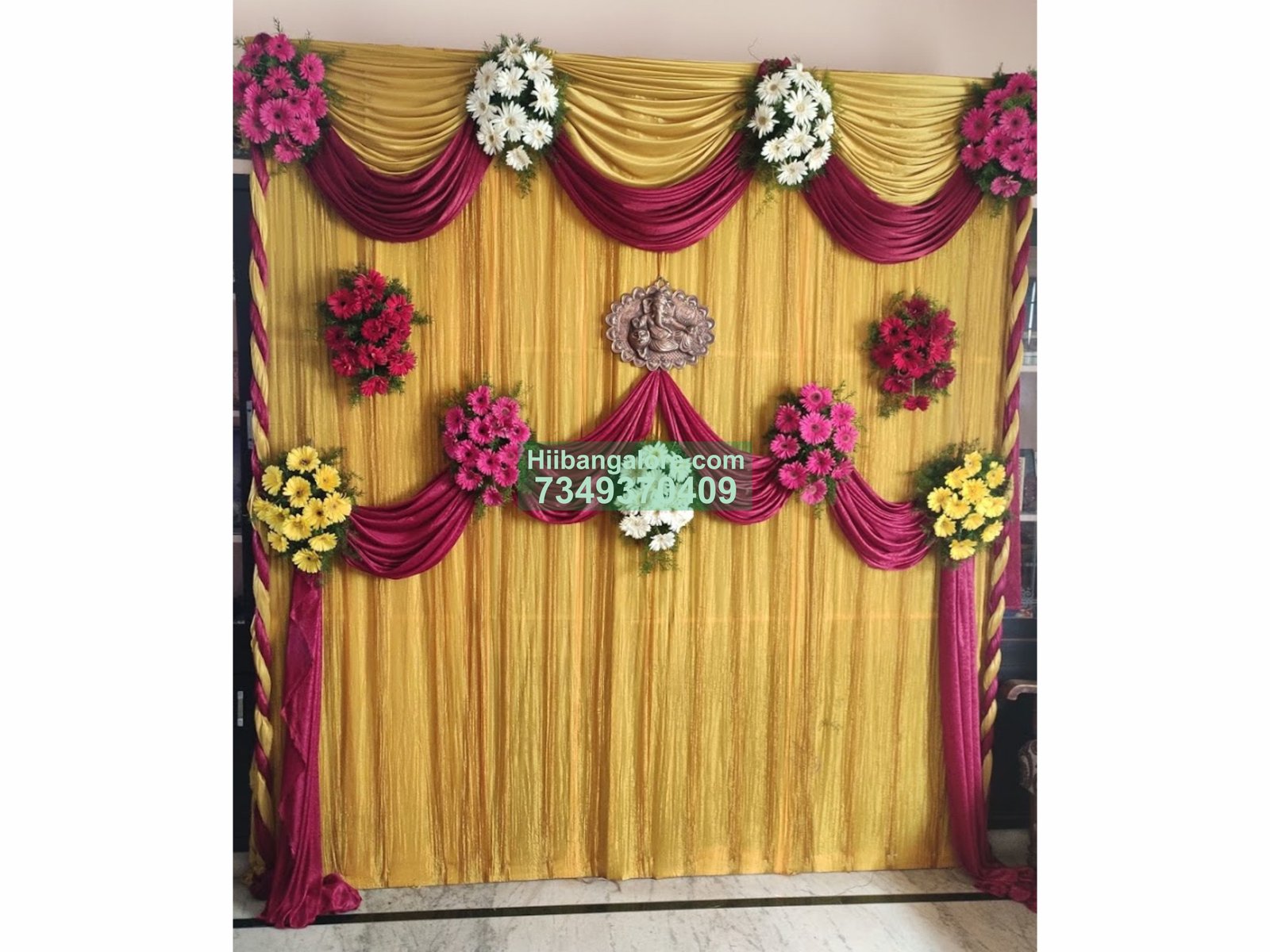 Simple maroon and golden backdrop engagement decoration at home Bangalore