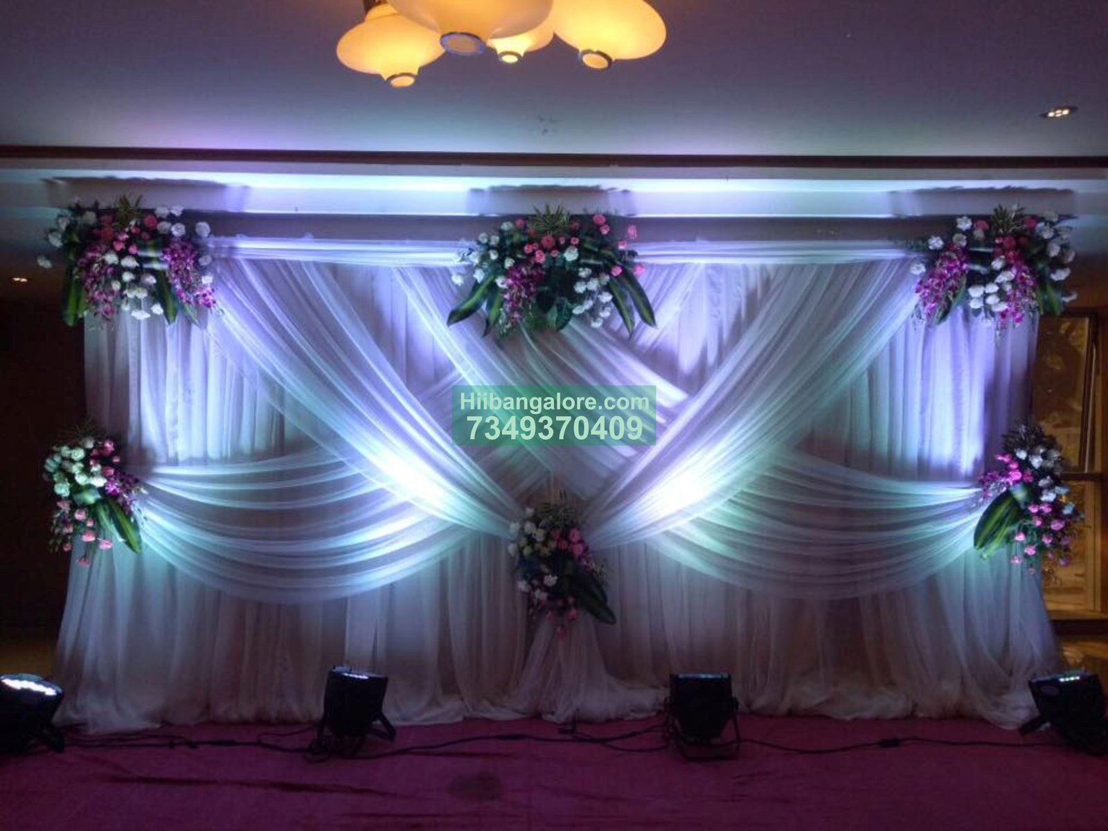 white backdrop orchid floral decoration for engagement Bangalore