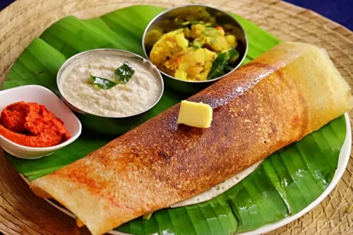 Crispy Andhra style masala dosa with chutney served for catering events in Bangalore