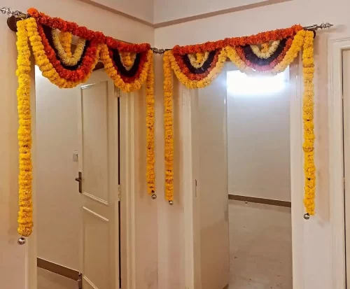 Bedroom door flower arrangements for griha pravesh ceremony in Bangalore