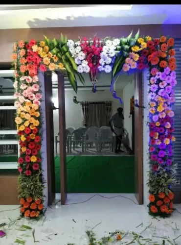 Griha pravesh main door flower decoration with jasmine and marigold