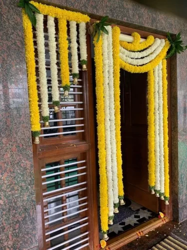 Traditional floral decor for gruhapravesha main door in Bangalore
