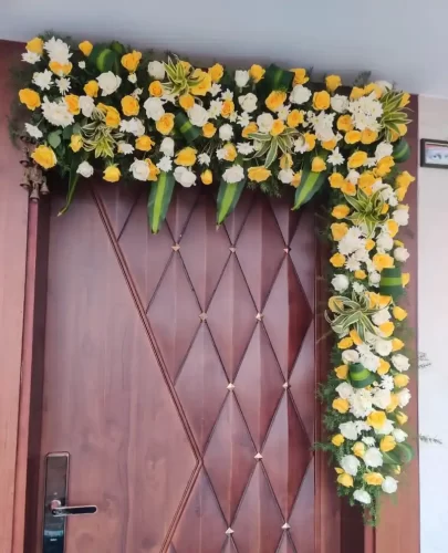 Fresh flower bedroom door decoration for gruhapravesham ceremony in Bangalore